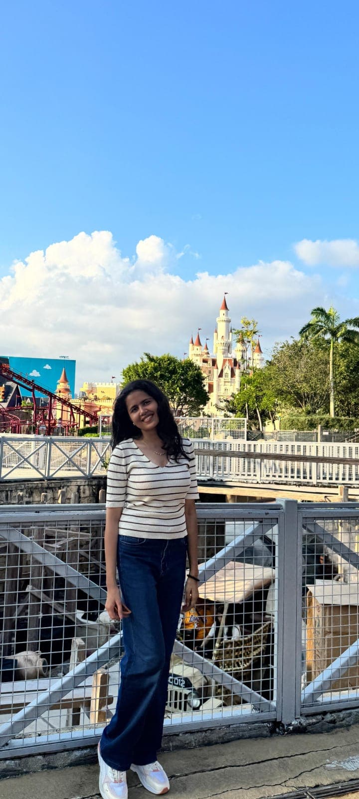 Riya travelling, with a castle in the background